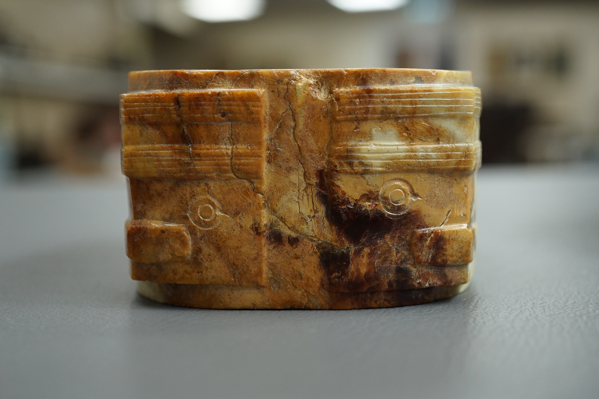 Four Chinese archaistic hardstone or burnt jade cong or cylinders